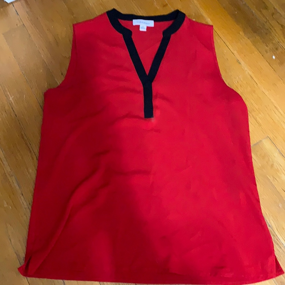 Calvin Klein “Girl Boss” sleeveless blouse